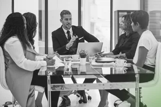 Consultant congratulating client on successfully beginning business operations.Consultant congratulating client on successfully beginning business operations.