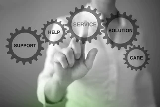 Hand touching a set of glowing interconnected gears labeled with customer service and business support keywords: Service, Solution, Care.