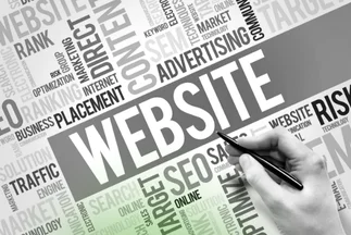 A hand holding a pen pointing at the large central word "WEBSITE," surrounded by a cloud of related terms like "SEO," "Traffic," and "Advertising."