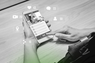 Hand holding a smartphone, tapping the 'Share' button on a social media post with floating icons for likes, comments, and engagement metrics.