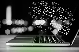 Hand-drawn email icons flying out of a laptop screen, symbolizing sending mass emails or email marketing.